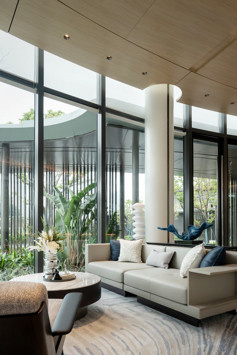 Modern living room with a sectional sofa and garden view.